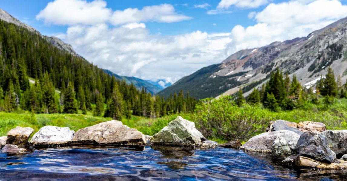 Hot springs blue pool on Conundrum Creek Trail in Aspen, Colorado in 2019 summer with rocks stones and valley view with nobody Hot springs blue pool on Conundrum Creek Trail in Aspen, Colorado in 2019 summer with rocks stones and valley view with nobody